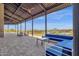 Large covered patio with seating area and views of pool and community at 32269 N 133Rd Dr, Peoria, AZ 85383