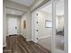 Bright entryway with wood flooring and access to an office at 32269 N 133Rd Dr, Peoria, AZ 85383