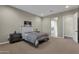 Bright bedroom with plush carpeting and lots of natural light at 32269 N 133Rd Dr, Peoria, AZ 85383