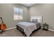 Cozy bedroom with a double bed and guitar at 32269 N 133Rd Dr, Peoria, AZ 85383