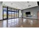 Bright, open community room with large windows and polished concrete floors at 32269 N 133Rd Dr, Peoria, AZ 85383