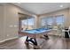Game room with pool table and plenty of space to entertain at 32269 N 133Rd Dr, Peoria, AZ 85383