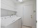 Laundry room with washer, dryer, and extra shelving at 8875 E Conquistadores Dr, Scottsdale, AZ 85255