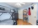 bedroom with a bunk bed, bookshelf, and closet at 947 W Barcelona Dr, Gilbert, AZ 85233