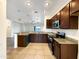 Modern kitchen with granite countertops and stainless steel appliances at 432 W Flame Tree Ave, San Tan Valley, AZ 85140