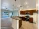 Modern kitchen with granite countertops and stainless steel appliances at 432 W Flame Tree Ave, San Tan Valley, AZ 85140