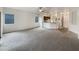 Spacious living room with carpeted flooring and access to the kitchen at 432 W Flame Tree Ave, San Tan Valley, AZ 85140