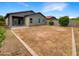 Large backyard with gravel and space for outdoor activities at 432 W Flame Tree Ave, San Tan Valley, AZ 85140
