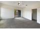 Bright bedroom with carpet flooring and sliding glass door to backyard at 432 W Flame Tree Ave, San Tan Valley, AZ 85140
