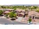 Aerial view of a two-story house with a large yard and mountain views at 11490 N 162Nd Ln, Surprise, AZ 85379