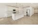 Open concept kitchen with island and stainless steel appliances at 37375 W Patterson St, Maricopa, AZ 85138
