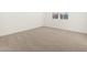 Simple bedroom with carpet and window with blinds at 37375 W Patterson St, Maricopa, AZ 85138