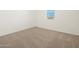 Simple bedroom with neutral carpet and window at 37375 W Patterson St, Maricopa, AZ 85138