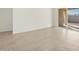 Spacious living area featuring tile floors and sliding glass doors at 37375 W Patterson St, Maricopa, AZ 85138