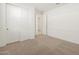 Spacious bedroom featuring carpet flooring and double doors to closet at 37375 W Patterson St, Maricopa, AZ 85138