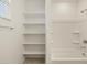 Clean bathroom with shelving, shower, and bathtub at 37375 W Patterson St, Maricopa, AZ 85138