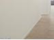 Clean and simple hallway with neutral color palette at 37375 W Patterson St, Maricopa, AZ 85138