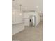 Modern kitchen with white cabinets, stainless steel appliances, and island at 37375 W Patterson St, Maricopa, AZ 85138