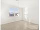 Bright dining room with large window and modern chandelier at 37375 W Patterson St, Maricopa, AZ 85138