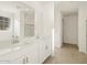 Bright bathroom with double vanity, large mirror, and tile flooring at 37375 W Patterson St, Maricopa, AZ 85138