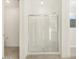 Clean shower with glass enclosure and built-in shelving at 37375 W Patterson St, Maricopa, AZ 85138