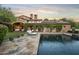 Stunning pool and patio area with a beautiful stone design at 19452 N 98Th Pl, Scottsdale, AZ 85255