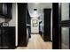 Long walk-in closet with dark wood cabinetry and plenty of storage at 19452 N 98Th Pl, Scottsdale, AZ 85255