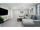 Spacious Gathering room with comfortable sectional sofa and large TV at 19452 N 98Th Pl, Scottsdale, AZ 85255