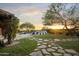 Landscaped backyard with stone pathway and pool at 19452 N 98Th Pl, Scottsdale, AZ 85255