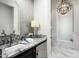 Elegant bathroom with marble flooring, a soaking tub, and a large shower at 19452 N 98Th Pl, Scottsdale, AZ 85255