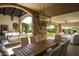 Covered patio with dining and seating areas at 19452 N 98Th Pl, Scottsdale, AZ 85255