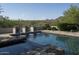 Luxury pool with three ornate fountains and mountain views at 19452 N 98Th Pl, Scottsdale, AZ 85255