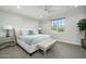 Bedroom with light and airy feel, plush bedding, and a bench at 19452 N 98Th Pl, Scottsdale, AZ 85255