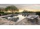 Luxury pool and spa with stone patio and water features at 19452 N 98Th Pl, Scottsdale, AZ 85255