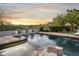 Stunning pool and spa with mountain views at sunset at 19452 N 98Th Pl, Scottsdale, AZ 85255