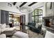 Living room with a fireplace, large windows, and comfortable seating at 19452 N 98Th Pl, Scottsdale, AZ 85255