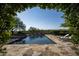 Stunning pool with fountains, surrounded by stone patio at 19452 N 98Th Pl, Scottsdale, AZ 85255