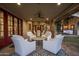 Covered patio with comfortable seating and access to the dining area at 19452 N 98Th Pl, Scottsdale, AZ 85255