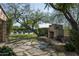 Stone fireplace with wood pile, situated on flagstone patio at 19452 N 98Th Pl, Scottsdale, AZ 85255