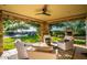 Relaxing patio with seating area, fireplace, and views of the backyard at 19452 N 98Th Pl, Scottsdale, AZ 85255
