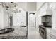 Elegant kitchen with marble countertops, high-end appliances, and ample storage at 19452 N 98Th Pl, Scottsdale, AZ 85255