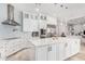 Modern kitchen with white cabinets, stainless steel appliances, and a large island at 12 E Quartz Rock Rd, Phoenix, AZ 85085