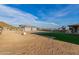 Large backyard with gravel and partial view of home at 12 E Quartz Rock Rd, Phoenix, AZ 85085