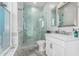 Clean bathroom with a walk-in shower, toilet, and white vanity with quartz countertop at 12 E Quartz Rock Rd, Phoenix, AZ 85085