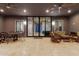 Outdoor patio with seating area, dining table, and glass doors leading inside at 12 E Quartz Rock Rd, Phoenix, AZ 85085