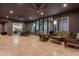 Spacious covered patio with seating area, dining table, and views to backyard at 12 E Quartz Rock Rd, Phoenix, AZ 85085