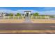 Modern home with a long driveway and a white fence at 12 E Quartz Rock Rd, Phoenix, AZ 85085