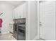Laundry room with white cabinets, washer, dryer, and a sink at 12 E Quartz Rock Rd, Phoenix, AZ 85085