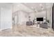 Spacious living room with large TV, comfy sofas, and tiled floors at 12 E Quartz Rock Rd, Phoenix, AZ 85085