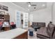 Spacious home office with a desk, seating area, and access to another room at 12 E Quartz Rock Rd, Phoenix, AZ 85085